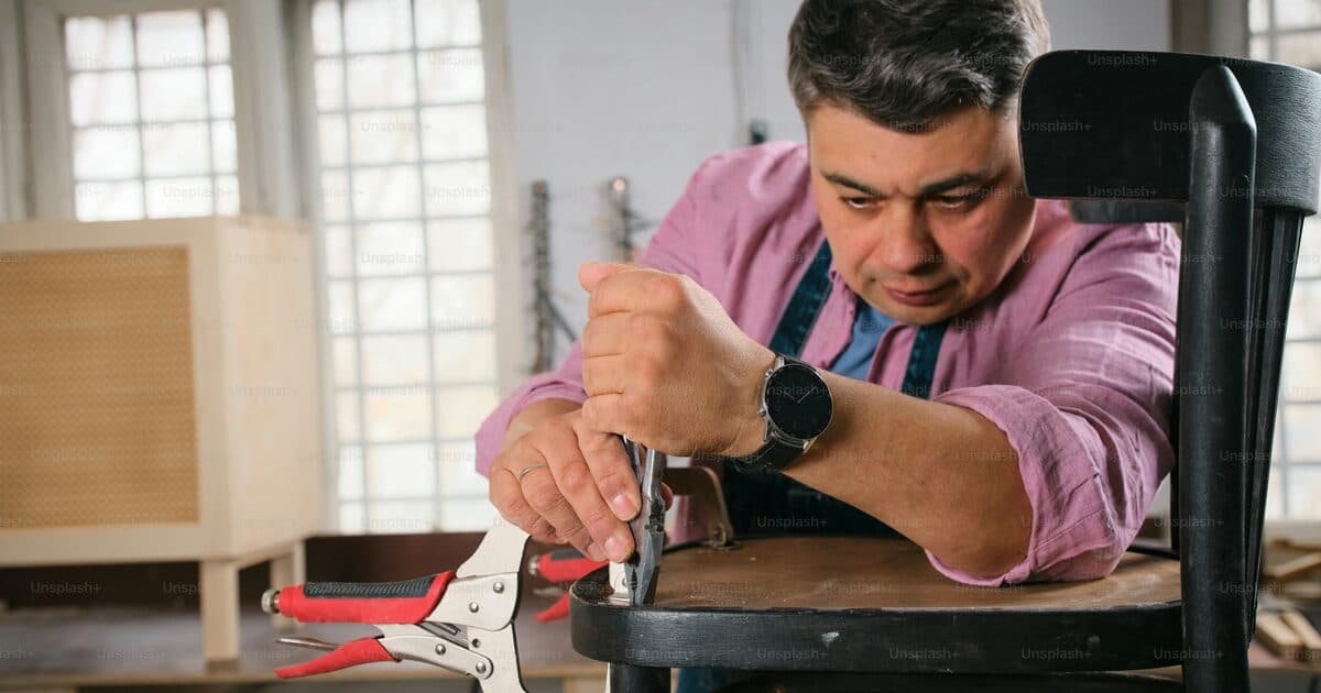 A craftsman working in a workshop, demonstrating skill through active work